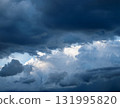 A moody, dark, cloudy background 131995820