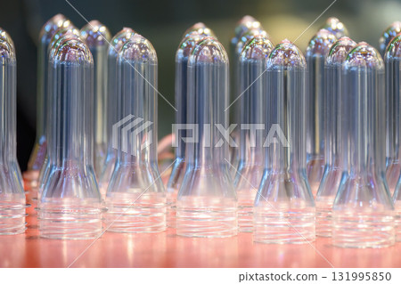 Close up scene of group of preform shape of PET bottle products 131995850
