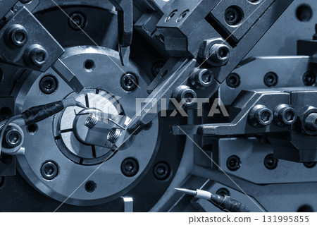 Close up scene operation of the coil spring making machine. 131995855