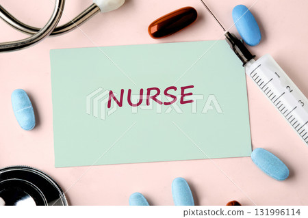 Stethoscope, syringe, and pills surround a note that reads Nurse on a light pink background. A visual tribute highlighting the tools and dedication of healthcare professionals 131996114