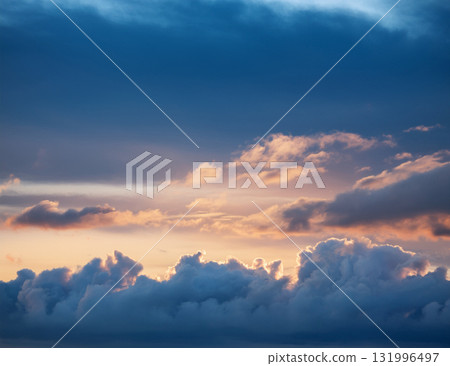 Blue and orange calm morning sky texture 131996497