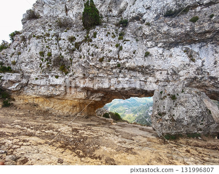 wide shot of La Foradada rock arch in Spain 131996807