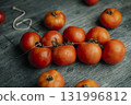 Spanish tomates de colgar on a rustic gray table 131996812