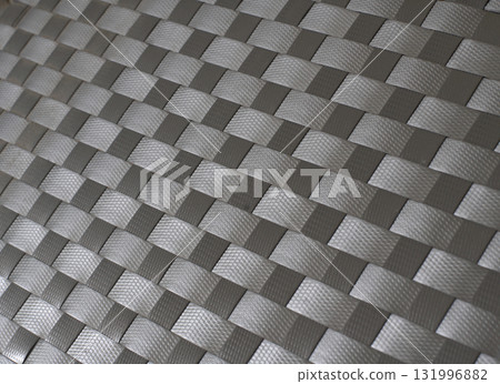 Handmade weave pattern of gray plastic strips texture for mats, baskets or rattan furniture. Handmade weave pattern of gray plastic strips texture for mats, baskets or rattan furniture. 131996882