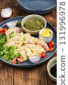 Raw chicken medallions. 131996978
