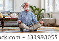 elderly man calmly meditating in living room lifestyle for blood pressure care 131998055