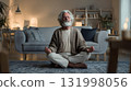 elderly man calmly meditating in living room lifestyle for blood pressure care 131998056