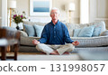 elderly man calmly meditating in living room lifestyle for blood pressure care 131998057