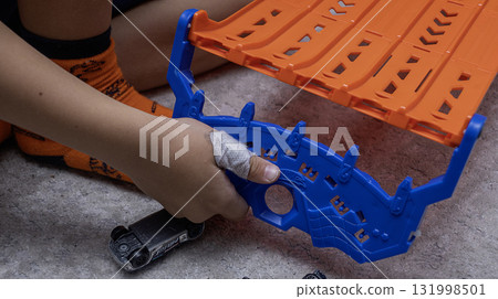 The child has a cut wound covered with a bandage The child has a cut wound covered with a bandage 131998501