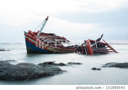 Old wrecked fishing boat on coast of Ang Sila Village, Chonburi Province of thailand. 131998543