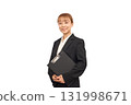A woman in a business suit holding documents 131998671