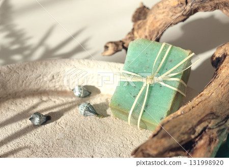 Cubes of natural soap against backdrop of natural elements. Handicrafts and hobbies. Cosmetics and beauty. Eco-friendly products. Background, composition for design. 131998920