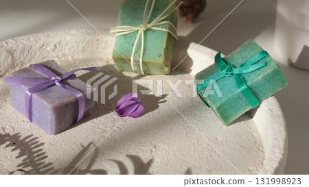 Cubes of natural soap against backdrop of natural elements. Handicrafts and hobbies. Cosmetics and beauty. Eco-friendly products. Background, composition for design. 131998923