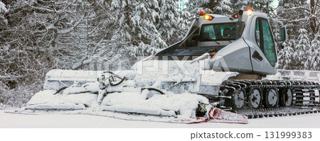 Snow groomer ratrack machine close-up, ski slope 131999383