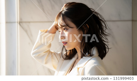 Woman in a white jacket, natural outdoor portrait 131999403