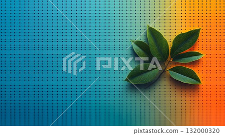 Green leaves on textured blue and orange background 132000320