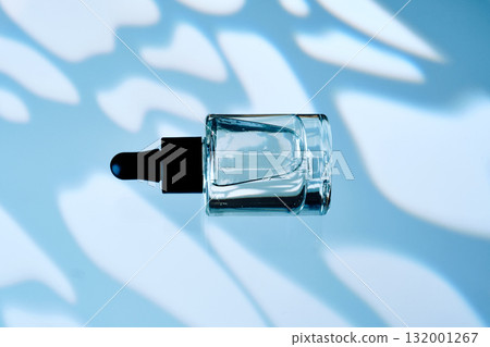 Oil for face or hair on a blue background. Oil for face or hair on a blue background. 132001267