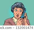 A woman listens to the phone in great surprise. Interaction with the company's client base. Communication with the client for business. 132001474