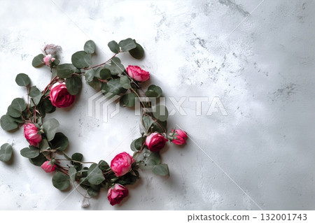 Beautiful Pink Roses With Eucalyptus Leaves Arranged on a Light Background for a Fresh Look 132001743