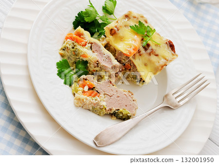 Cheesy ground meat vegetables casserole on a plate Cheesy ground meat vegetables casserole on a plate 132001950