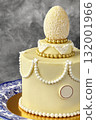 Delicious white chocolate easter cake decorated with coconut egg 132001966