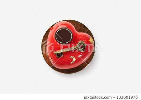 Heart-shaped red cake decorated with golden key for valentine's day or anniversary 132001970