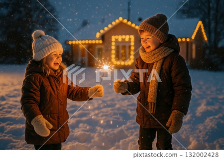 Children Celebrating Winter With Sparklers in a Snowy Evening Landscape 132002428