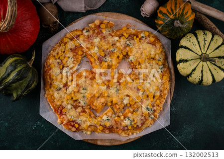 Halloween scary pizza in shape of pumpkin Halloween scary pizza in shape of pumpkin 132002513