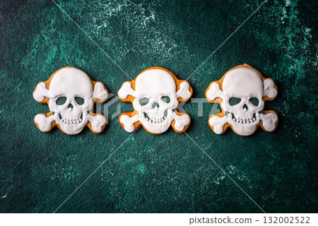 Halloween cookies in shape of ghost, jack-o-lantern and skull 132002522
