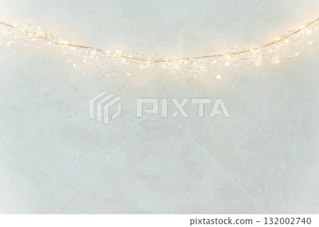 Warm String Lights on Textured Wall in Minimal Festive Interior Warm String Lights on Textured Wall in Minimal Festive Interior 132002740