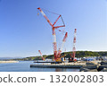 Autumn photo of a large crane at a wind turbine removal work base in Esashi, Hokkaido. 132002803