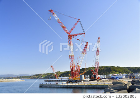 Autumn photo of a large crane at a wind turbine removal work base in Esashi, Hokkaido. 132002803