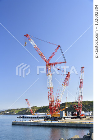 Autumn photo of a large crane at a wind turbine removal work base in Esashi, Hokkaido. Autumn photo of a large crane at a wind turbine removal work base in Esashi, Hokkaido. 132002804