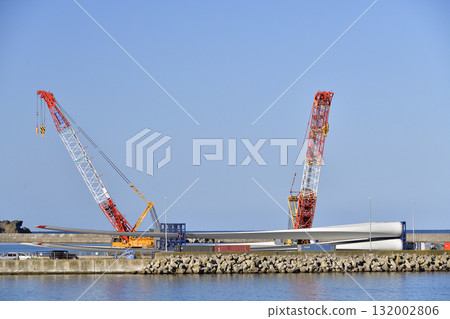 Autumn photo of a large crane at a wind turbine removal work base in Esashi, Hokkaido. 132002806