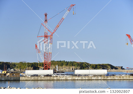 Autumn photo of a large crane at a wind turbine removal work base in Esashi, Hokkaido. 132002807