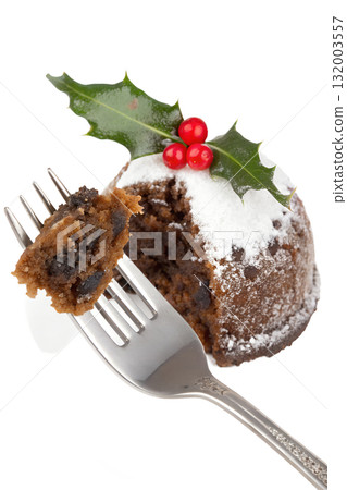 Fork with piece of traditional christmas pudding with brandy sauce and holly, festive dessert isolated on transparent background Fork with piece of traditional christmas pudding with brandy sauce and holly, festive dessert isolated on transparent background 132003557