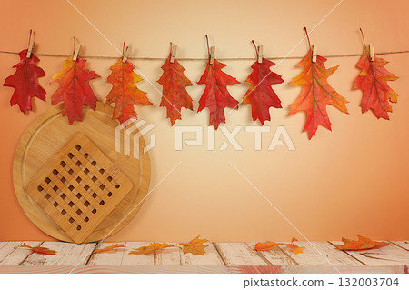 Autumn abstract composition with maple leaves in a vase on an elegant modern kitchen table, still life and Thanksgiving concept, seasonal background and banner for screen, greeting card. 132003704