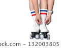 Female lacing up white roller skates with striped socks 132003805