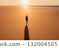 Human shadow cast gently across sandy ground.AI Generated 132004505
