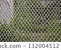 Woven metal mesh forming a grid fence structure.AI Generated 132004512
