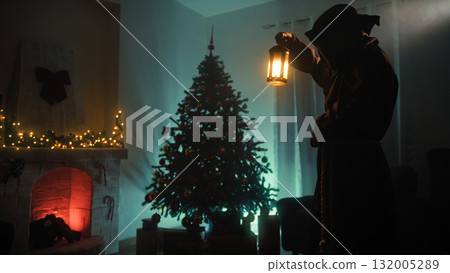 Mysterious Hooded Man Believes In Christmas In His Dark Room At Night Mysterious Hooded Man Believes In Christmas In His Dark Room At Night 132005289