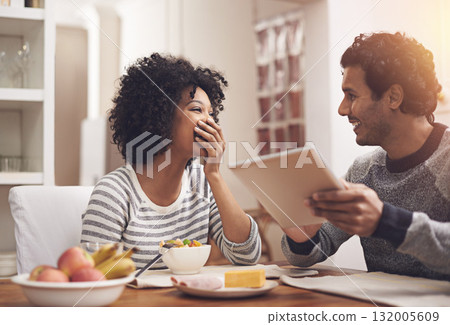 Love, breakfast and couple with a tablet, funny and happiness with joy, relax and bonding at home. Partners, man and happy woman in the kitchen, technology and loving with communication and laughing Love, breakfast and couple with a tablet, funny and happiness with joy, relax and bonding at home. Partners, man and happy woman in the kitchen, technology and loving with communication and laughing 132005609