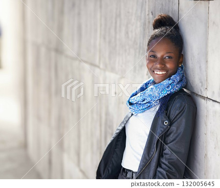 Portrait, urban fashion and black woman at wall with smile, graffiti and mockup standing at street art. Happiness, youth and happy face of gen z model in African city with streetwear and sunshine. Portrait, urban fashion and black woman at wall with smile, graffiti and mockup standing at street art. Happiness, youth and happy face of gen z model in African city with streetwear and sunshine. 132005645