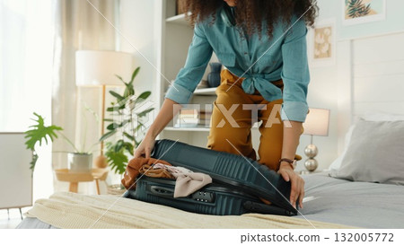 Bedroom, travel or woman with luggage or suitcase in a luxury hotel on vacation for adventure. Closeup, hands or person packing clothes in bag and ready for a holiday trip at a lodge, house or villa 132005772