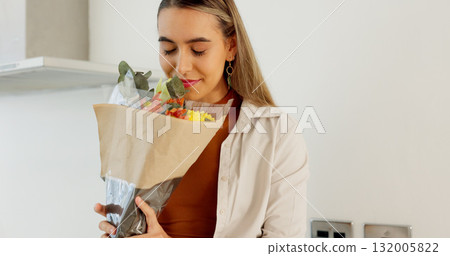 Love, flowers surprise and woman in home with romantic surprise with plant gift on anniversary event. Floral bouquet, calm woman and relax with present for wife for celebration in a home with smile 132005822