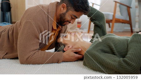 Property, success and couple relax on living room floor for moving, break or new home smile. Mortgage, real estate and man with woman lying on a carpet happy, investment or love with face touch care Property, success and couple relax on living room floor for moving, break or new home smile. Mortgage, real estate and man with woman lying on a carpet happy, investment or love with face touch care 132005959