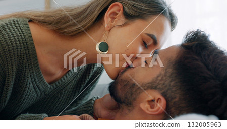 Couple kiss, love and passion with trust at home, trust and care for intimacy and bonding. People relax together, support and security with romance, partner and commitment in healthy relationship 132005963