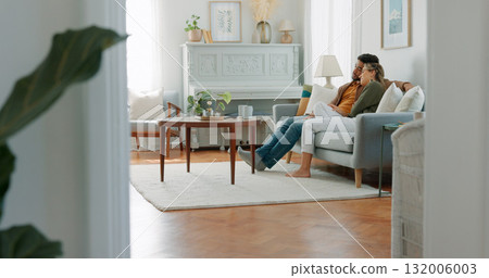 Couple, relax and watching tv on sofa, home or lounge for movie, streaming subscription or together on vacation. Man, woman and television on couch in living room on holiday, film or video in house 132006003
