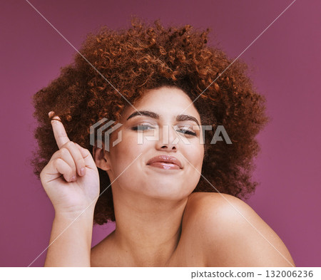 Hair care, curls and portrait of a woman with an afro isolated on a purple background in a studio. Salon, beauty and face of a model showing a curly hairstyle with pride and confidence on a backdrop Hair care, curls and portrait of a woman with an afro isolated on a purple background in a studio. Salon, beauty and face of a model showing a curly hairstyle with pride and confidence on a backdrop 132006236