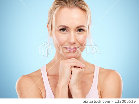 Mature skincare, portrait and face beauty of a woman with cosmetic dermatology and facial. Isolated, blue background and studio with model smile feeling happy about anti aging and collagen treatment Mature skincare, portrait and face beauty of a woman with cosmetic dermatology and facial. Isolated, blue background and studio with model smile feeling happy about anti aging and collagen treatment 132006539